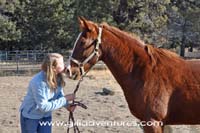 girl and sorrel horse